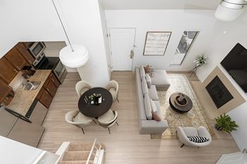 Living room with a large window and a wooden floor